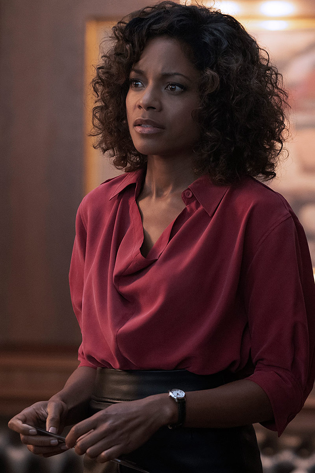 photo © Danjaq LLC, MGM, United Artists / via Omega watches Eve Moneypenny (Naomie Harris) wears a Joseph Murry Fuji silk blouse in No Time To Die
