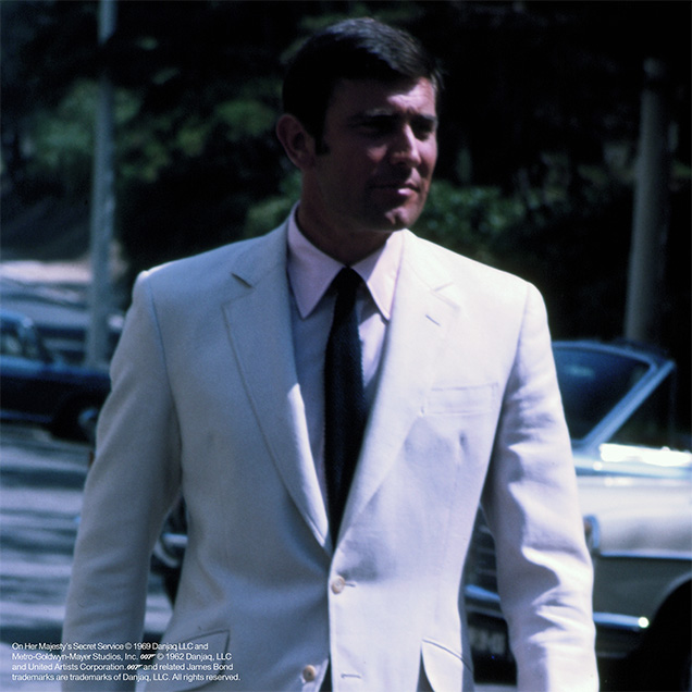 photo © Danjaq LLC, MGM, United Artists George Lazenby as James Bond in front of Hotel Palácio Estoril, Portugal, in On Her Majesty's Secret Service
